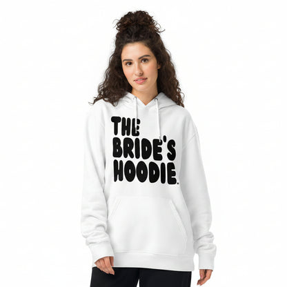 Woman wearing the APWT Gift Shop's the Bride's Hoodie Premium White Hoodie from the APWT Wedding Shop