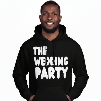 Man wearing the APWT Gift Shop's The Wedding Party Unisex Hoodie from the APWT Wedding Shop in Black