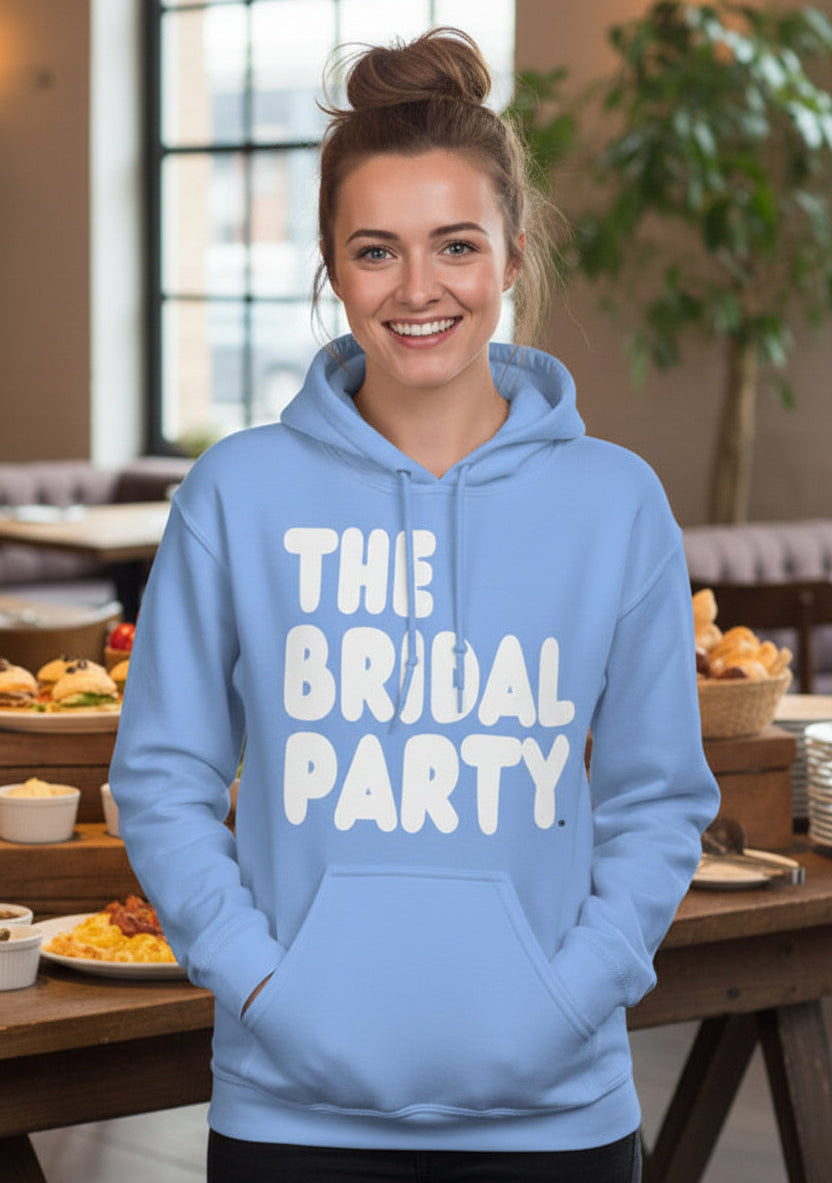 Woman wearing The APWT Gift Shop's the Bridal Party Unisex Hoodie from the APWT Wedding Shop in Light Blue