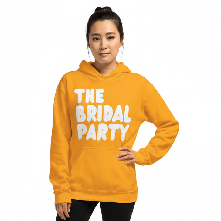 Woman wearing The APWT Gift Shop's the Bridal Party Unisex Hoodie from the APWT Wedding Shop in Gold
