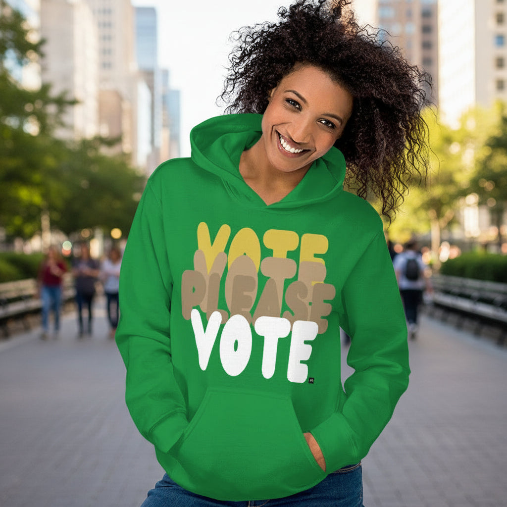 Woman in the park wearing Please Vote in Green Spaces Unisex Hoodie from the APWT Gift Shop -  Vote Advocacy Sweatshirt