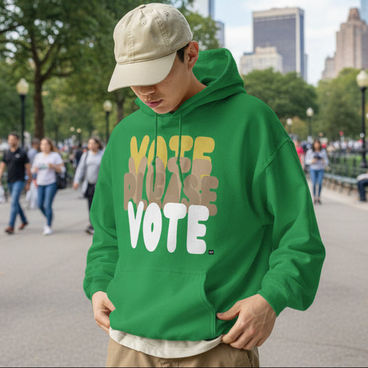Man standing in park wearing Please Vote in Green Spaces Unisex Hoodie from the APWT Gift Shop -  Vote Advocacy Sweatshirt