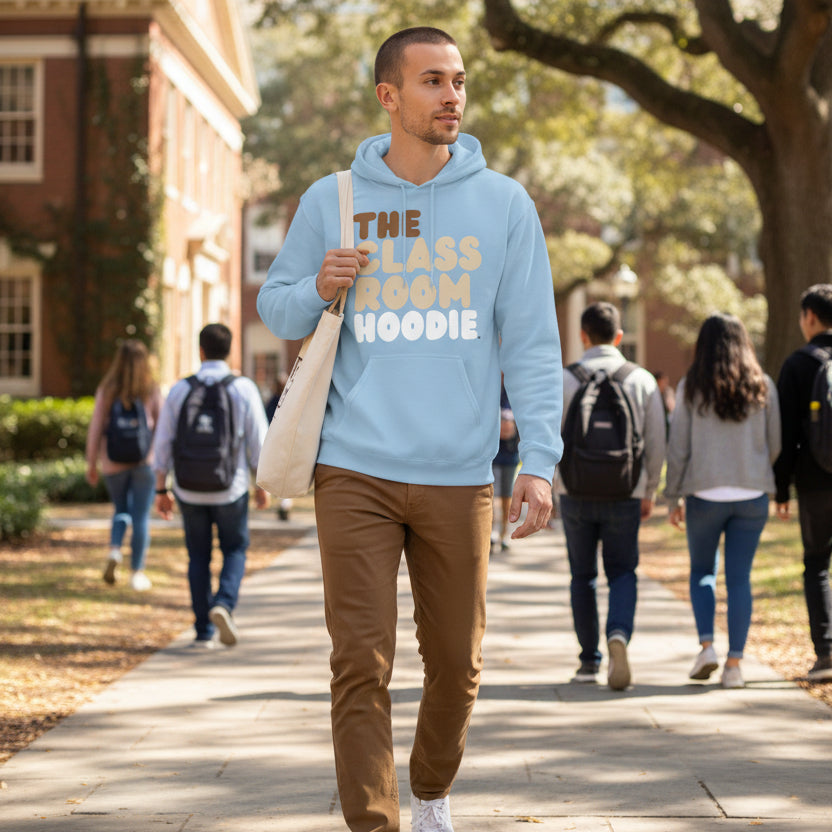 Man wearing the APWT Gift Shop's the Classroom Hoodie from the Day in the Life Collection in Light Blue walking through a school campus