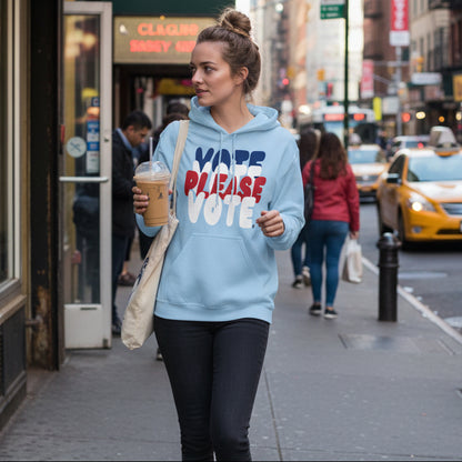 Woman wearing the APWT Gift Shop's Please Vote Unisex Hoodie from the APWT Vote Shop in Light Blue