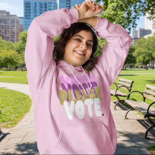 Woman in park wearing Please Vote in Primaries Pink Unisex Hoodie from the APWT Gift Shop -  Vote Advocacy Sweatshirt