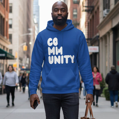 Man walking down the street wearing the APWT Gift Shop's A Community in Ocean Blue Unisex Hoodie from the Community Collection
