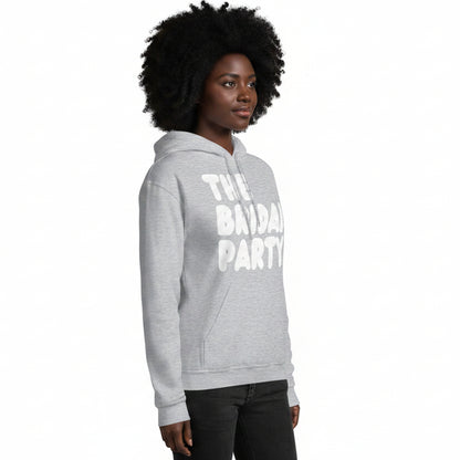Woman wearing The APWT Gift Shop's the Bridal Party Unisex Hoodie from the APWT Wedding Shop in Grey