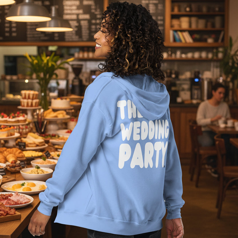 Woman wearing The Wedding Party Unisex Zip-Up Hoodie in Light Blue