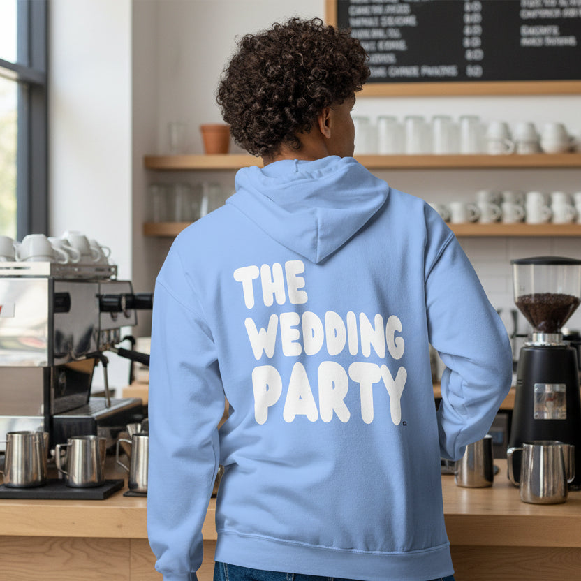 Man wearing The Wedding Party Unisex Zip-Up Hoodie in Light Blue