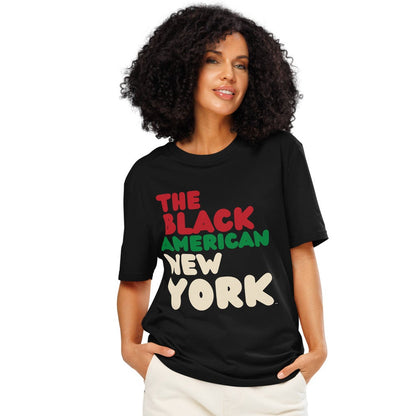 Woman wearing the APWT Gift Shop's the Black American New York Premium Unisex T-Shirt from the Black Collection