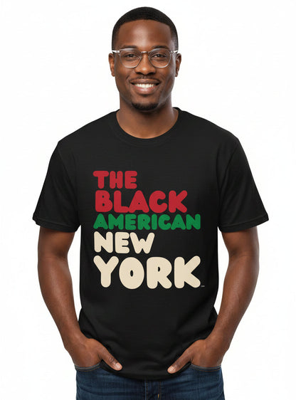 man wearing the APWT Gift Shop's the Black American New York Premium Unisex T-Shirt from the Black Collection