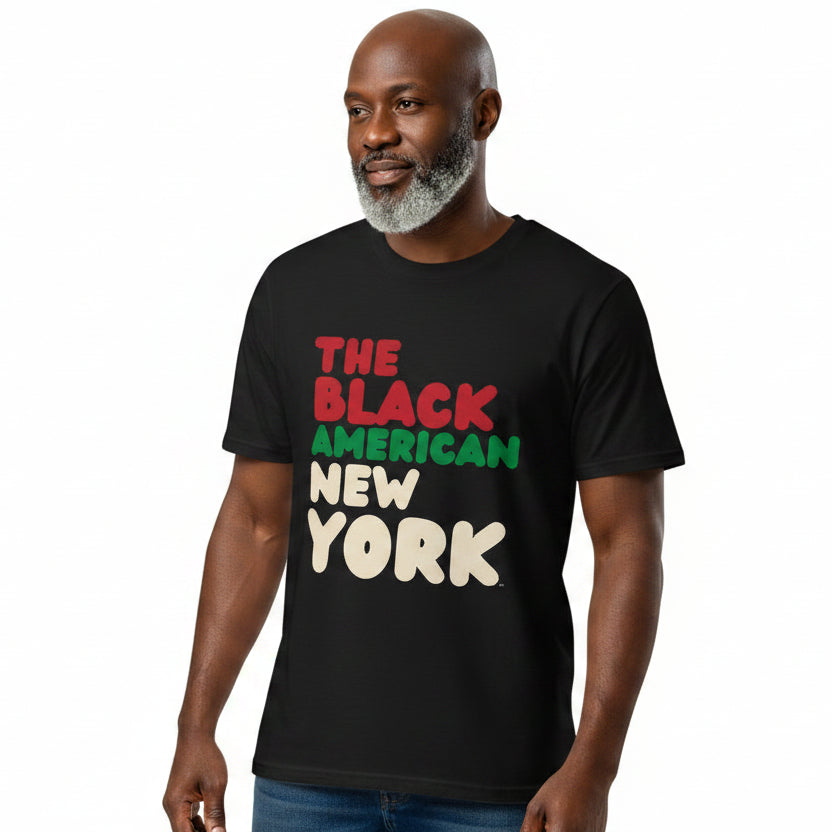 man wearing the APWT Gift Shop's the Black American Premium Unisex T-shirt from the Black Collection