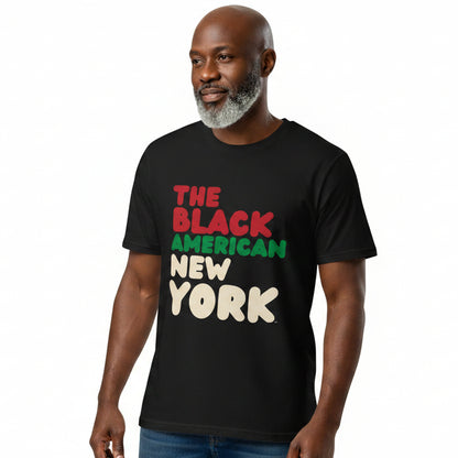 man wearing the APWT Gift Shop's the Black American Premium Unisex T-shirt from the Black Collection