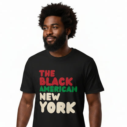Man wearing the APWT Gift Shop's the Black American Premium Unisex T-shirt from the Black Collection