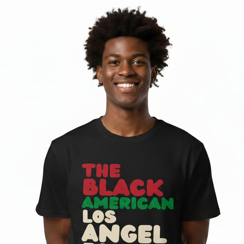Man wearing the APWT Gift Shop's The Black American Los Angeles Premium Unisex T-Shirt from the Black Collection
