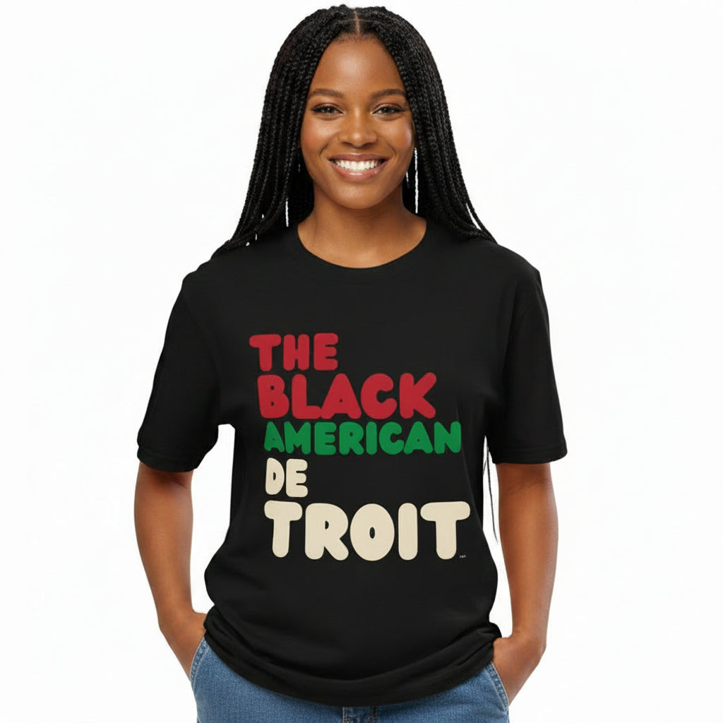 Woman wearing the APWT Gift Shop's the Black American Detroit Premium Unisex T-shirt from the Black Collection