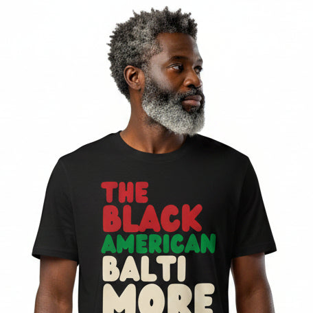 Man wearing The APWT Gift Shop's the Black American Baltimore Premium Unisex T-Shirt from the Black Collection