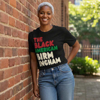 Woman wearing the APWT Gift Shop's the Black American Birmingham Premium Unisex T-Shirt from the Black Collection