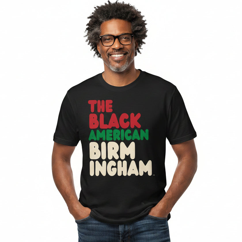 Man wearing the APWT Gift Shop's the Black American Birmingham Premium Unisex T-Shirt from the Black Collection