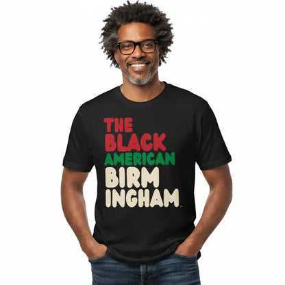Man wearing the APWT Gift Shop's the Black American Birmingham Premium Unisex T-Shirt from the Black Collection