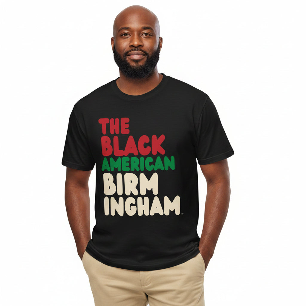 Man wearing the APWT Gift Shop's the Black American Birmingham Premium Unisex T-Shirt from the Black Collection