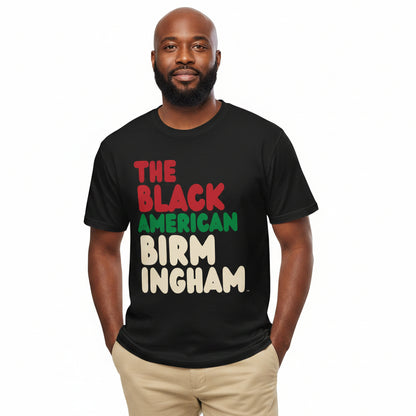 Man wearing the APWT Gift Shop's the Black American Birmingham Premium Unisex T-Shirt from the Black Collection