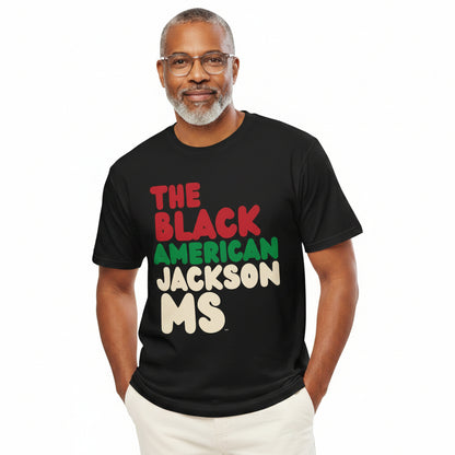 Man wearing the APWT Gift Shop's the Black American Jackson MS Premium Unisex T-Shirt from the Black Collection