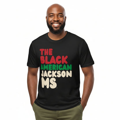 Man wearing the APWT Gift Shop's the Black American Jackson MS Premium Unisex T-Shirt from the Black Collection