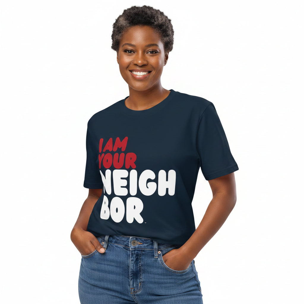 Woman wearing the APWT Gift Shop's I Am Your Neighbor in Turmoil Premium Unisex T-Shirt from the Day in the Life Collection