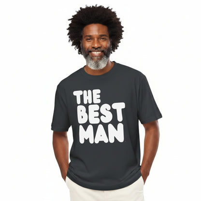 Man wearing the APWT Gift Shops The Best Man Premium Unisex T-Shirt from the APWT Wedding Shop in Charcoal Grey