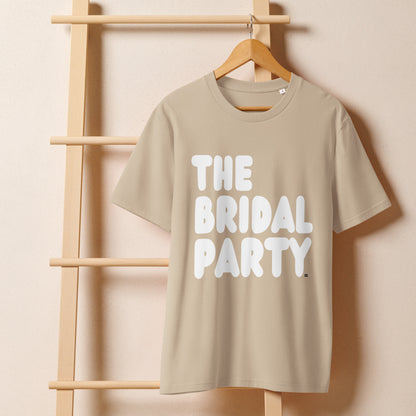 The Bridal Party Premium Unisex T-Shirt in Beige on a hanger