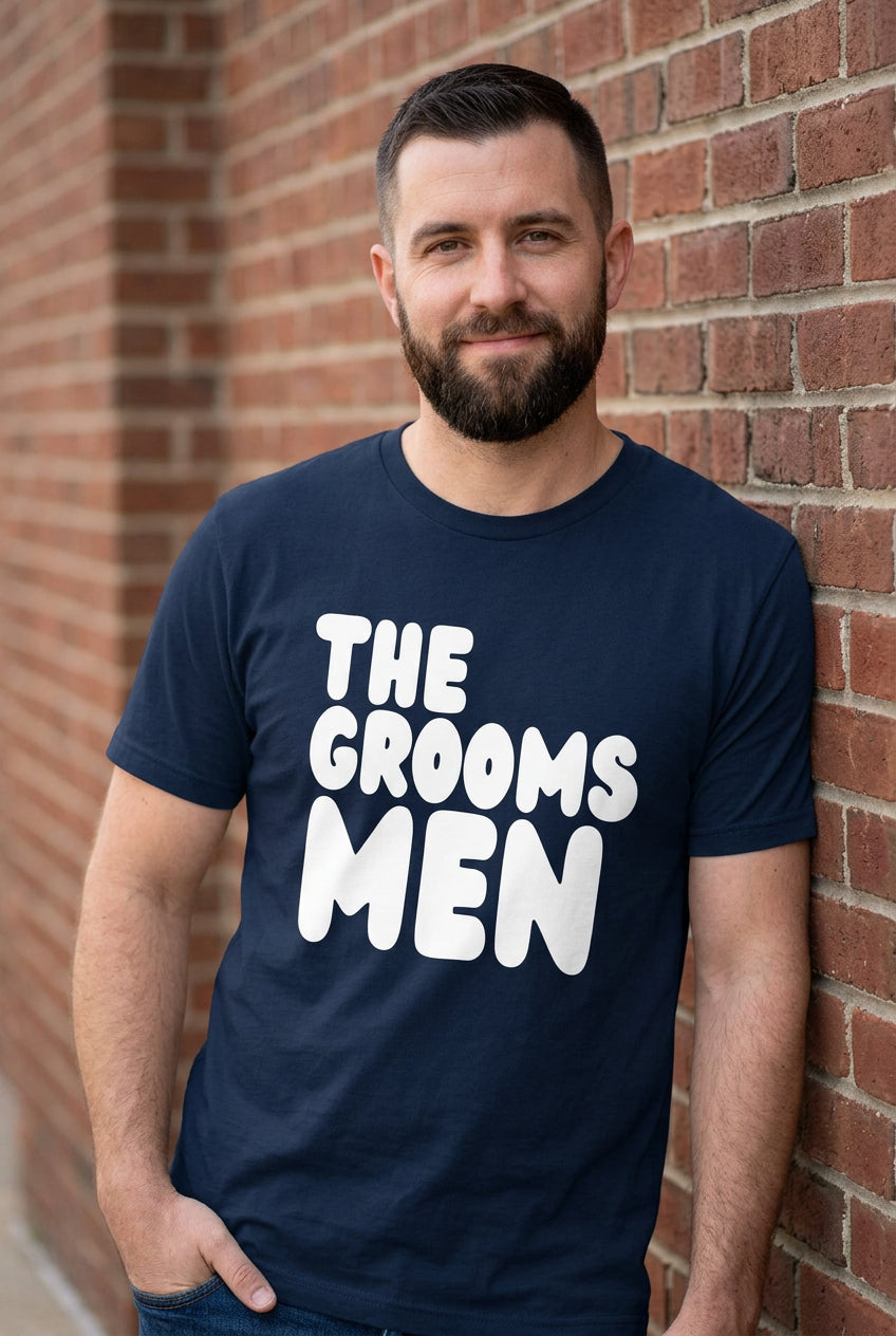 The APWT Gift Shop's The Groomsmen Premium Unisex T-Shirt from the APWT Wedding Shop in Navy Blue