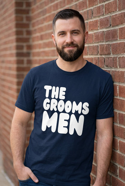 The APWT Gift Shop's The Groomsmen Premium Unisex T-Shirt from the APWT Wedding Shop in Navy Blue
