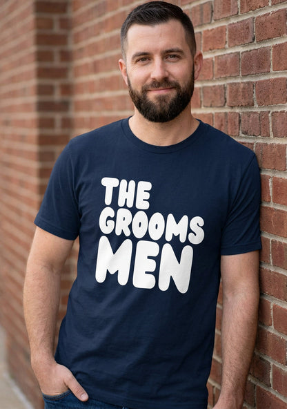 The APWT Gift Shop's The Groomsmen Premium Unisex T-Shirt from the APWT Wedding Shop in Navy Blue