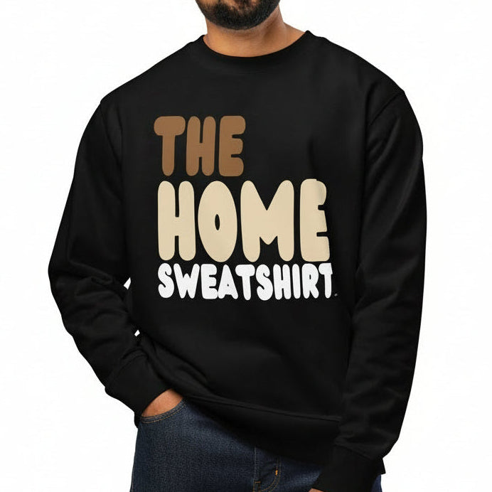 Man wearing a black sweatshirt with 'THE HOME SWEATSHIRT' text on a white background