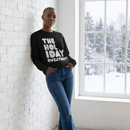Woman wearing the Holiday Celebration Premium Unisex Crew Neck Sweatshirt from the APWT Holiday Shop and the Premium Basics Collection