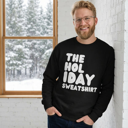 Man wearing the Holiday Celebration Premium Unisex Crew Neck Sweatshirt from the APWT Holiday Shop and the Premium Basics Collection