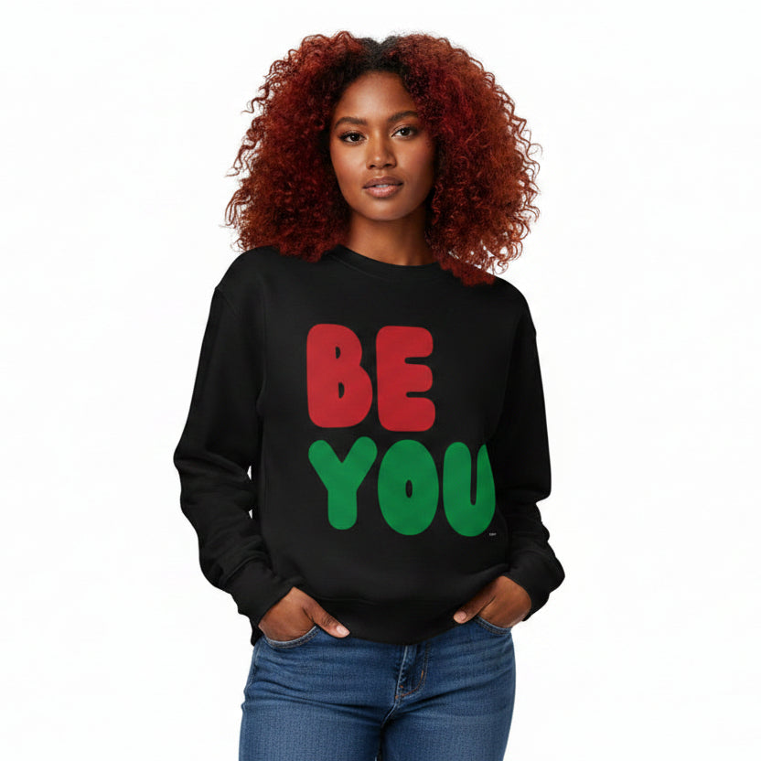 Woman wearing the APWT Gift Shop's Be You in Black Premium Unisex Crew Neck Sweatshirt from the Black Collection