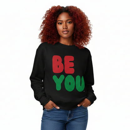 Woman wearing the APWT Gift Shop's Be You in Black Premium Unisex Crew Neck Sweatshirt from the Black Collection