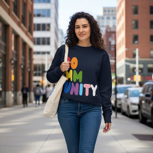 Woman walking down a city street wearing the APWT Gift Shop's Rainbow Community Premium Unisex Crew Neck Sweatshirt from the Community Collection and the Premium Basics Collection 