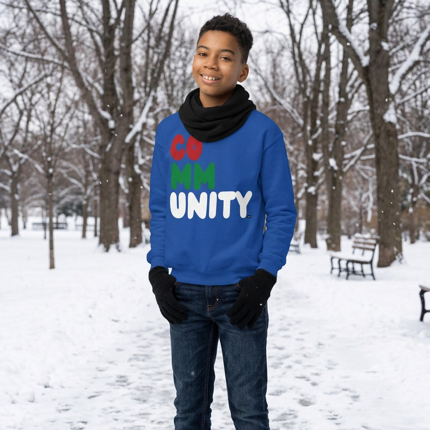 Boy wearing the APWT Gift Shop's Holiday Community Kid's Unisex Crew Neck Sweatshirt from the Community Collection and the APWT Kid's Shop in royal blue