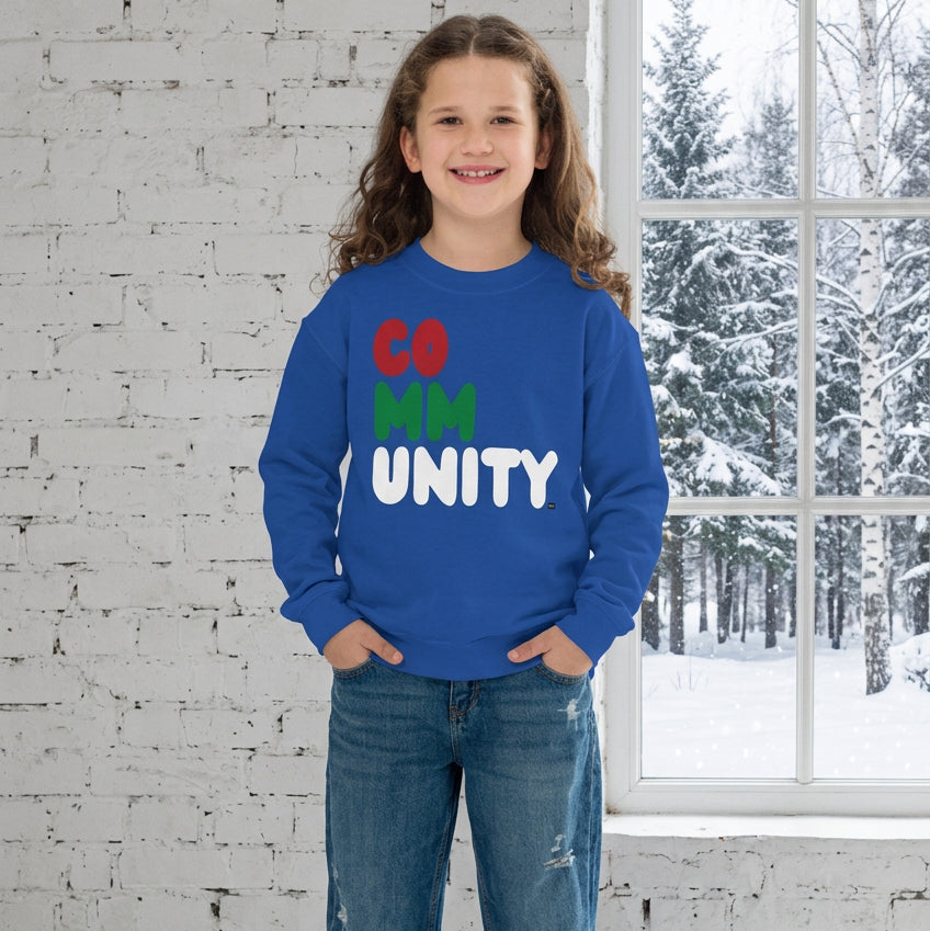 Girl wearing the APWT Gift Shop's Holiday Community Kid's Unisex Crew Neck Sweatshirt from the Community Collection and the APWT Kid's Shop in royal blue