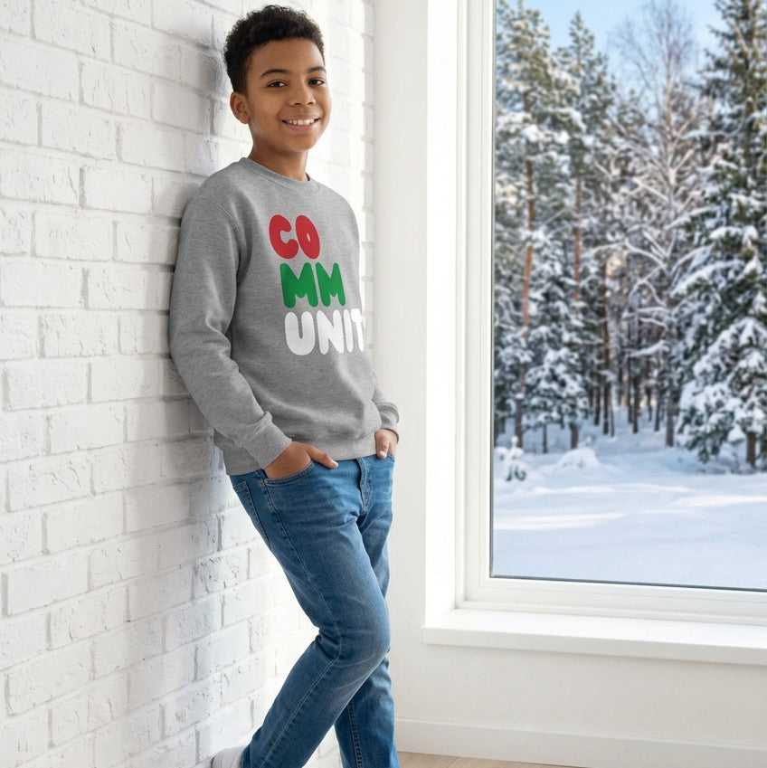 Boy wearing the APWT Gift Shop's Holiday Community Kid's Unisex Crew Neck Sweatshirt from the Community Collection and the APWT Kid's Shop in Grey
