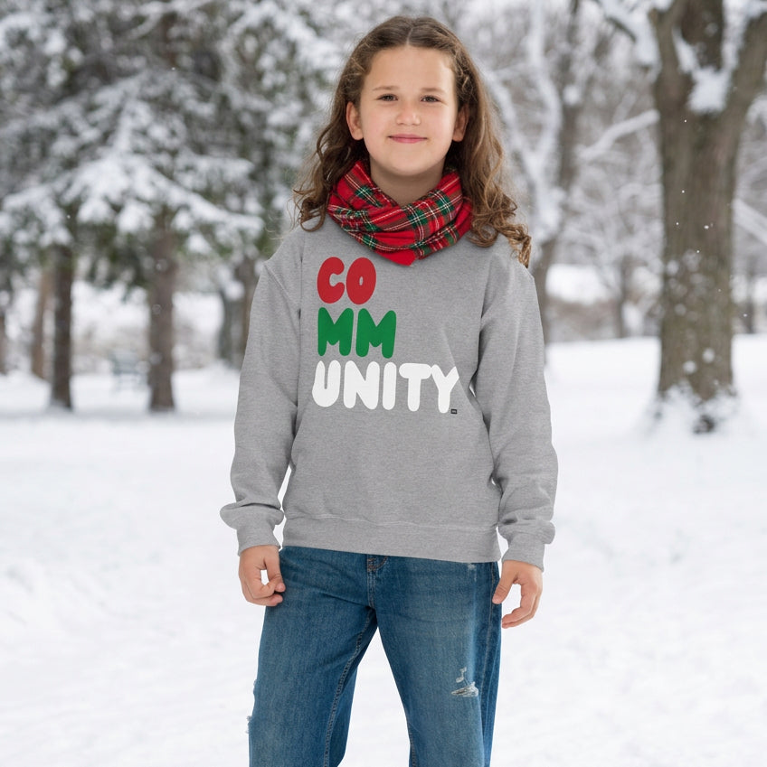 Girl wearing the APWT Gift Shop's Holiday Community Kid's Unisex Crew Neck Sweatshirt from the Community Collection and the APWT Kid's Shop in Grey
