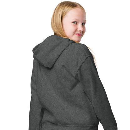 Girl showing the hood and back of Be You Kids in Yellow Unisex Hoodie in Dark Grey from the APWT Gift Shop -  Kids Affirmation Sweatshirts